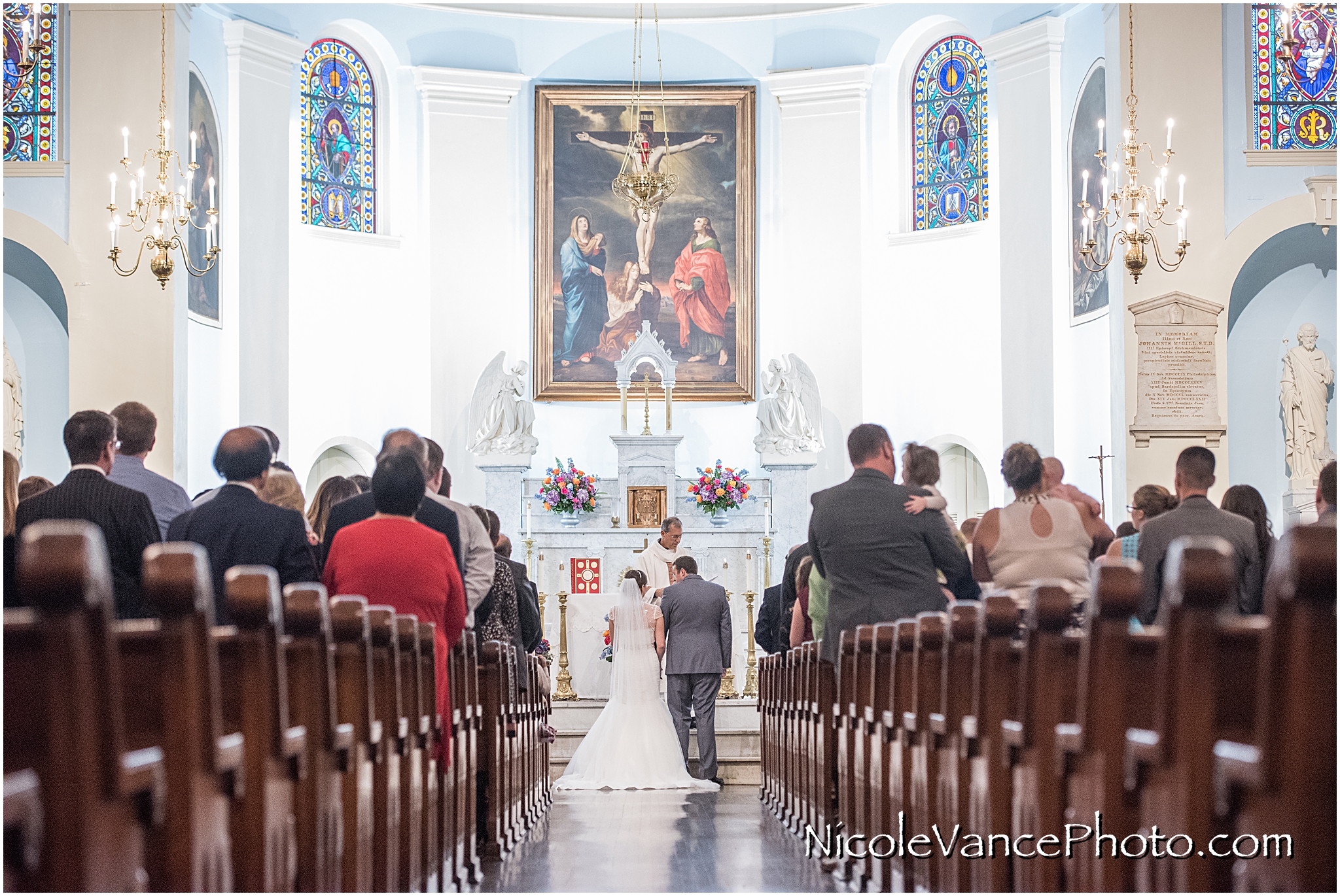 The wedding ceremony takes place at the beautiful and historic St Peter's Catholic Church in Richmond, Virginia.