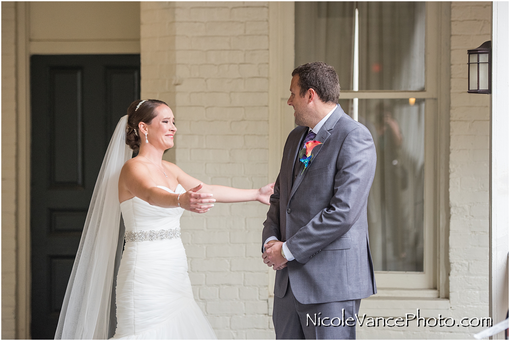 An emotional and touching first look together on the balcony at Linden Row Inn.