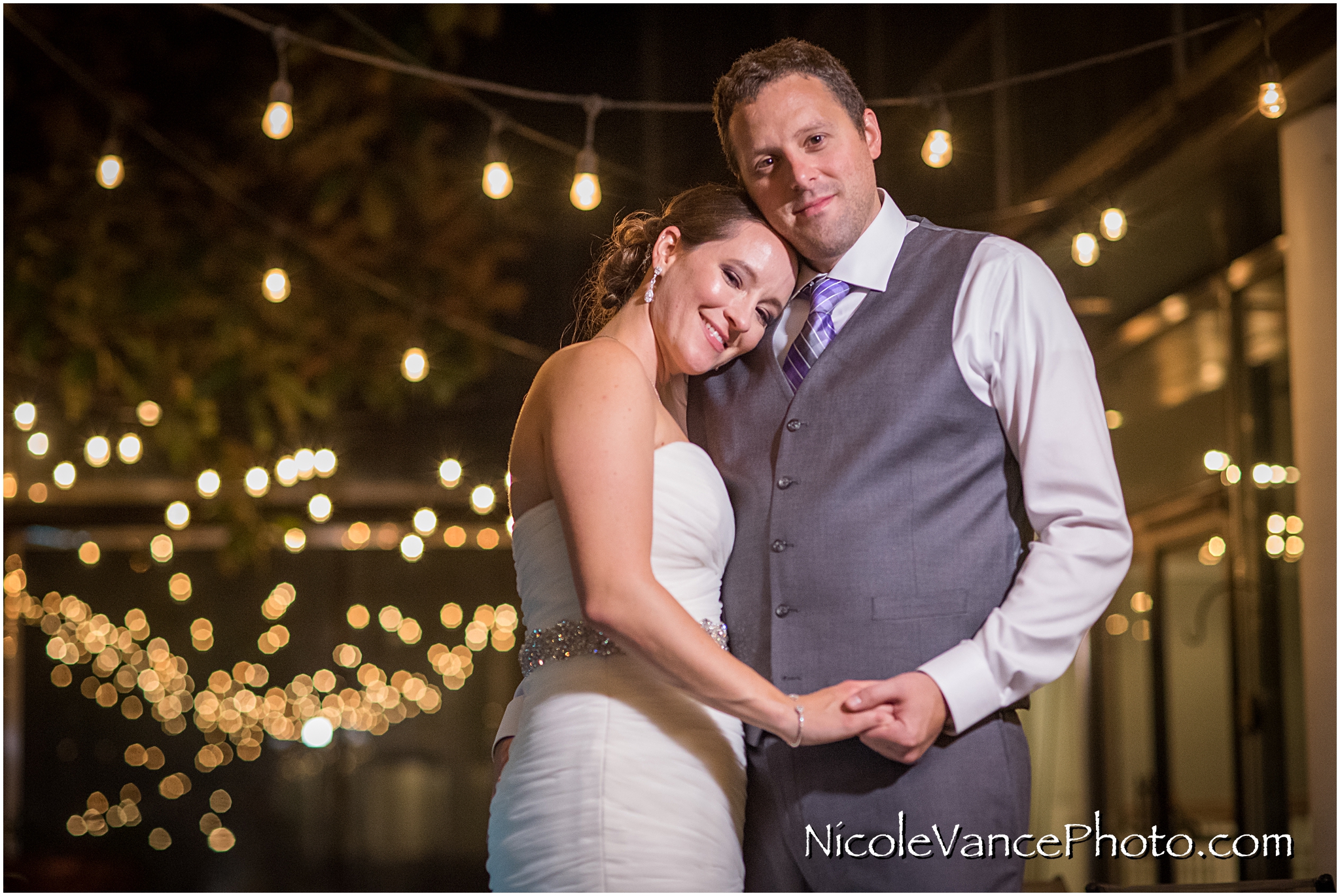 The bride and groom enjoy a quiet moment on the patio together at the Brownstone in Richmond, VA.