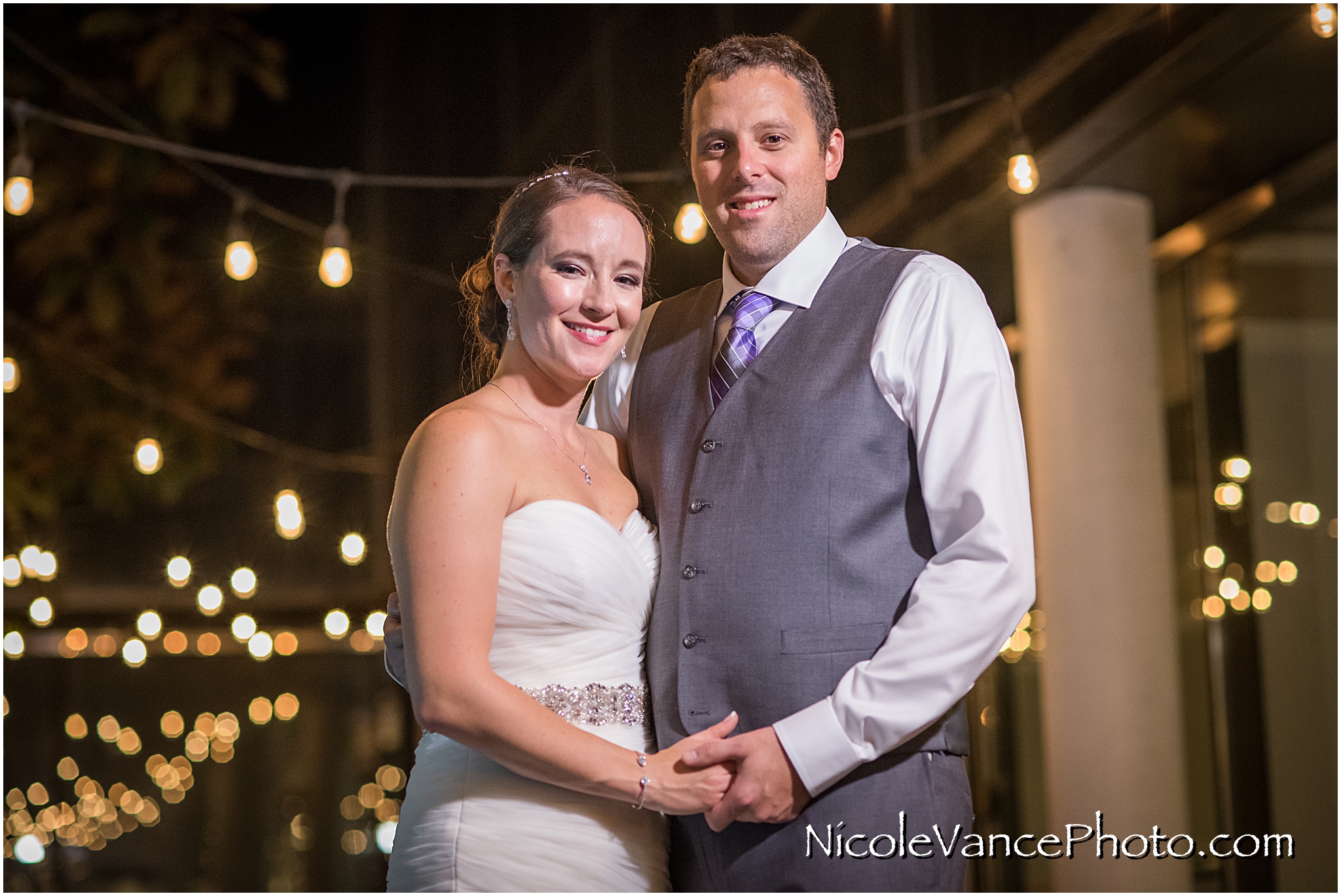 The bride and groom enjoy a quiet moment on the patio together at the Brownstone in Richmond, VA.