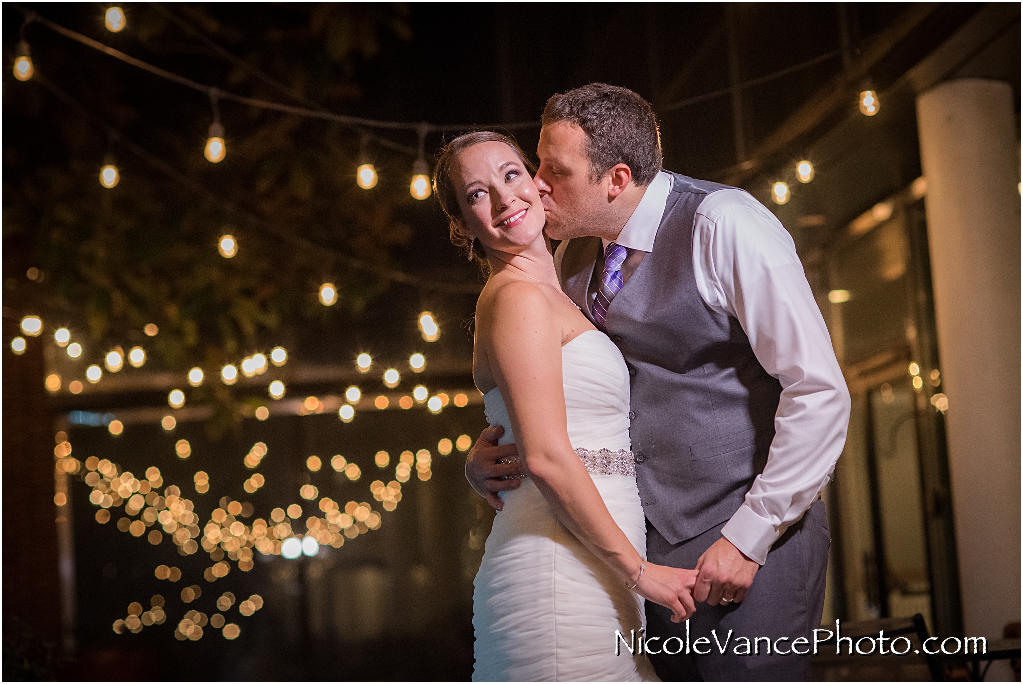 The bride and groom enjoy a quiet moment on the patio together at the Brownstone in Richmond, VA.