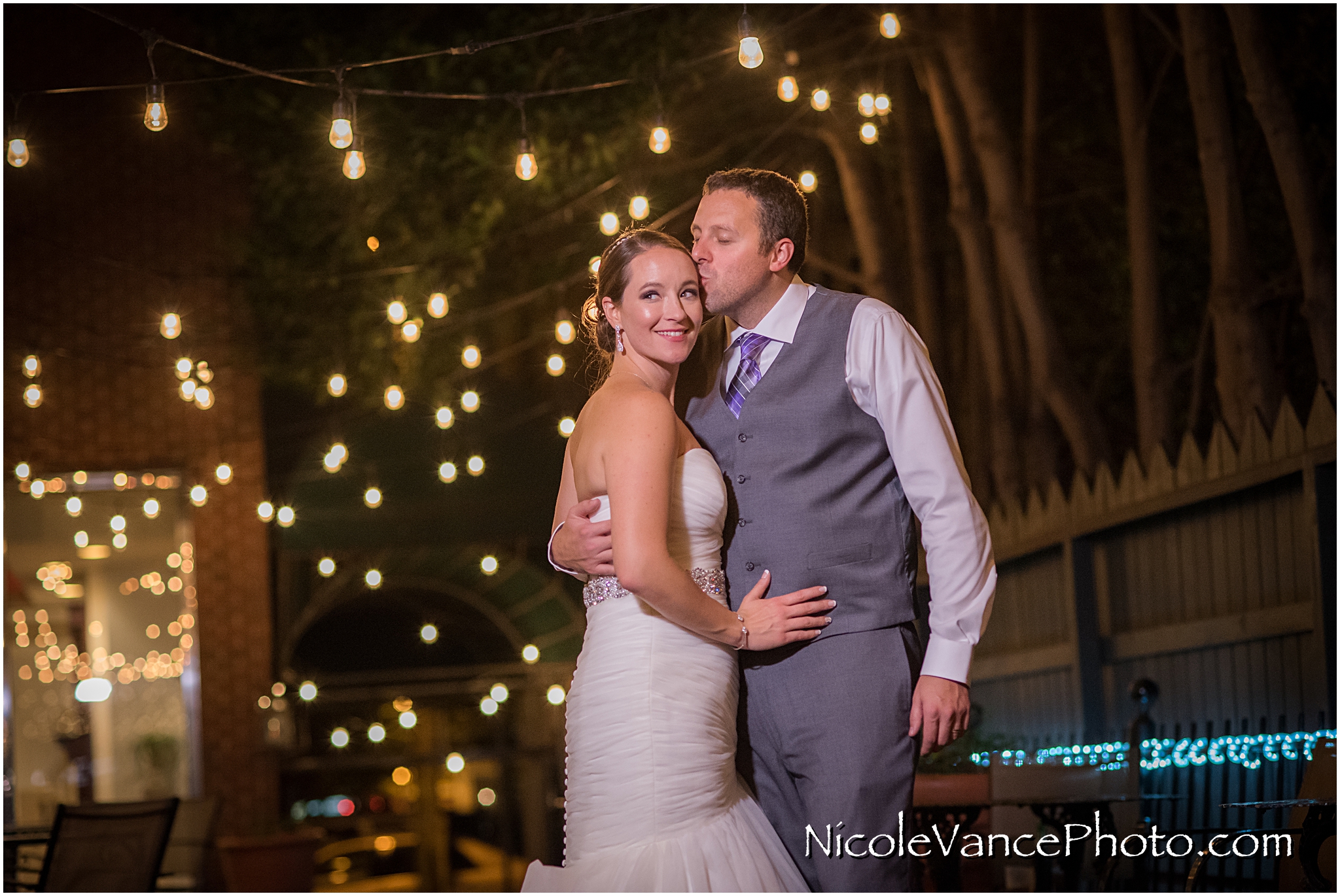 The bride and groom enjoy a quiet moment on the patio together at the Brownstone in Richmond, VA.