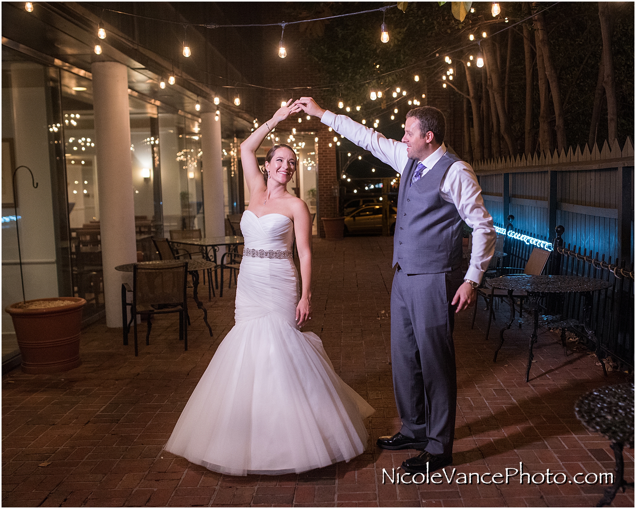 The bride and groom enjoy a quiet moment on the patio together at the Brownstone in Richmond, VA.