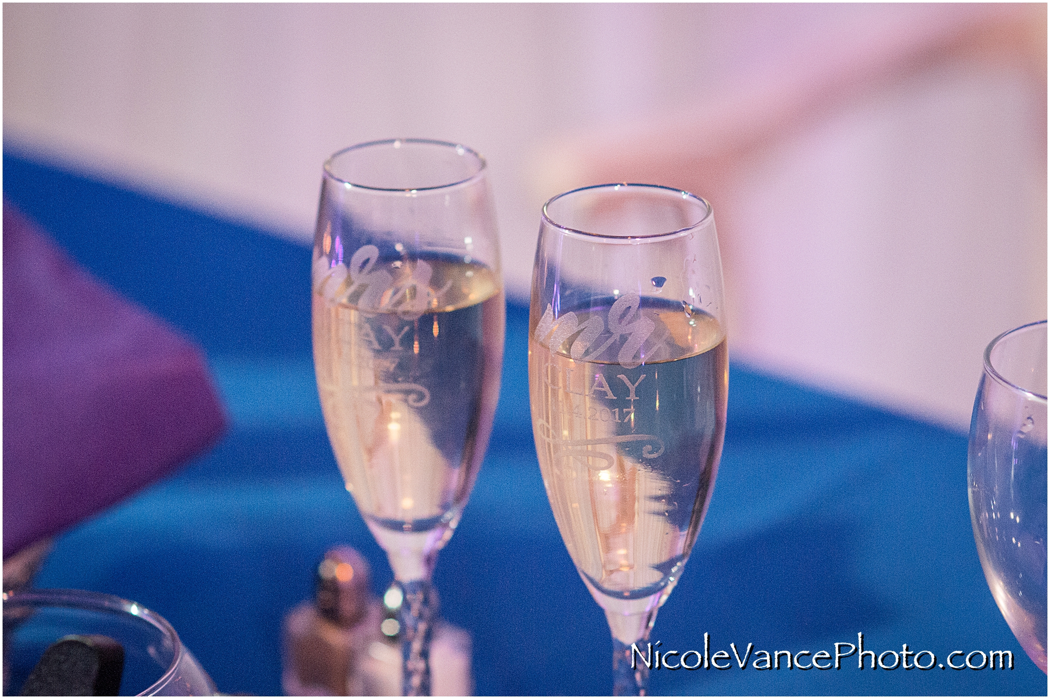 Etched champagne glasses await toasts at the wedding reception at The Brownstone.