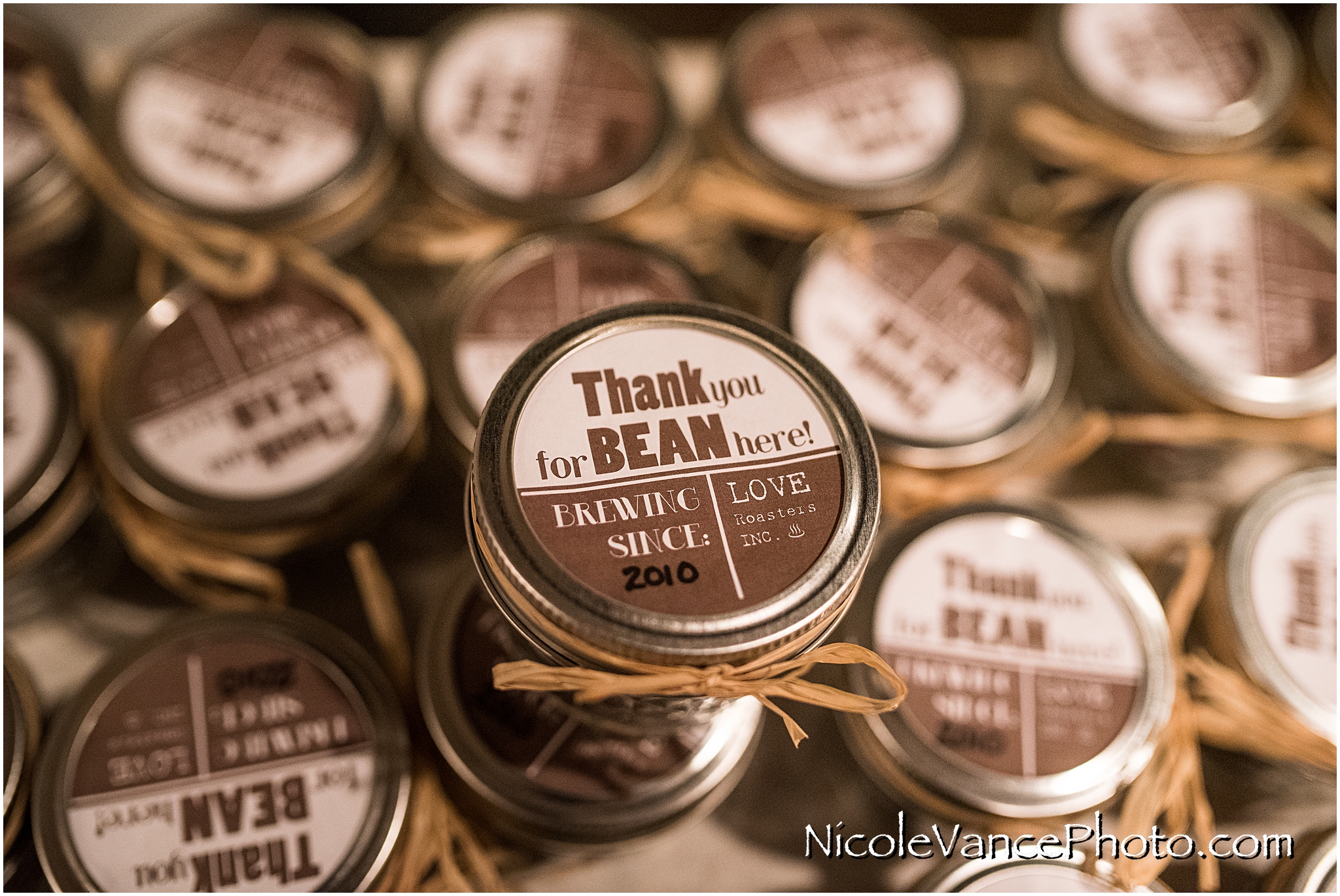 The bride had customized tea and coffee favors for their guests... the top said "Thank you for BEAN here!"