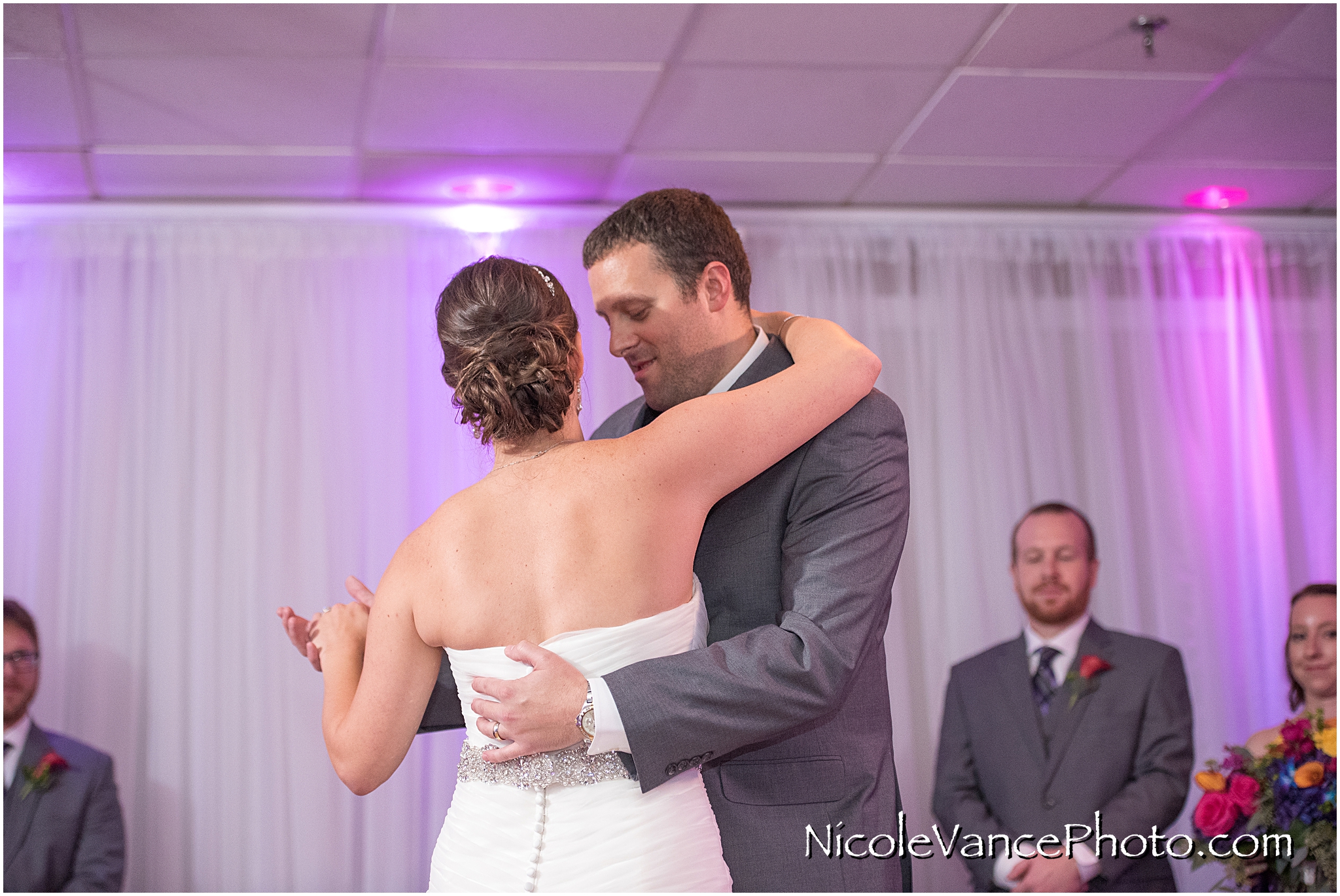 The bride and groom enjoy their first dance at their wedding reception at The Brownstone.