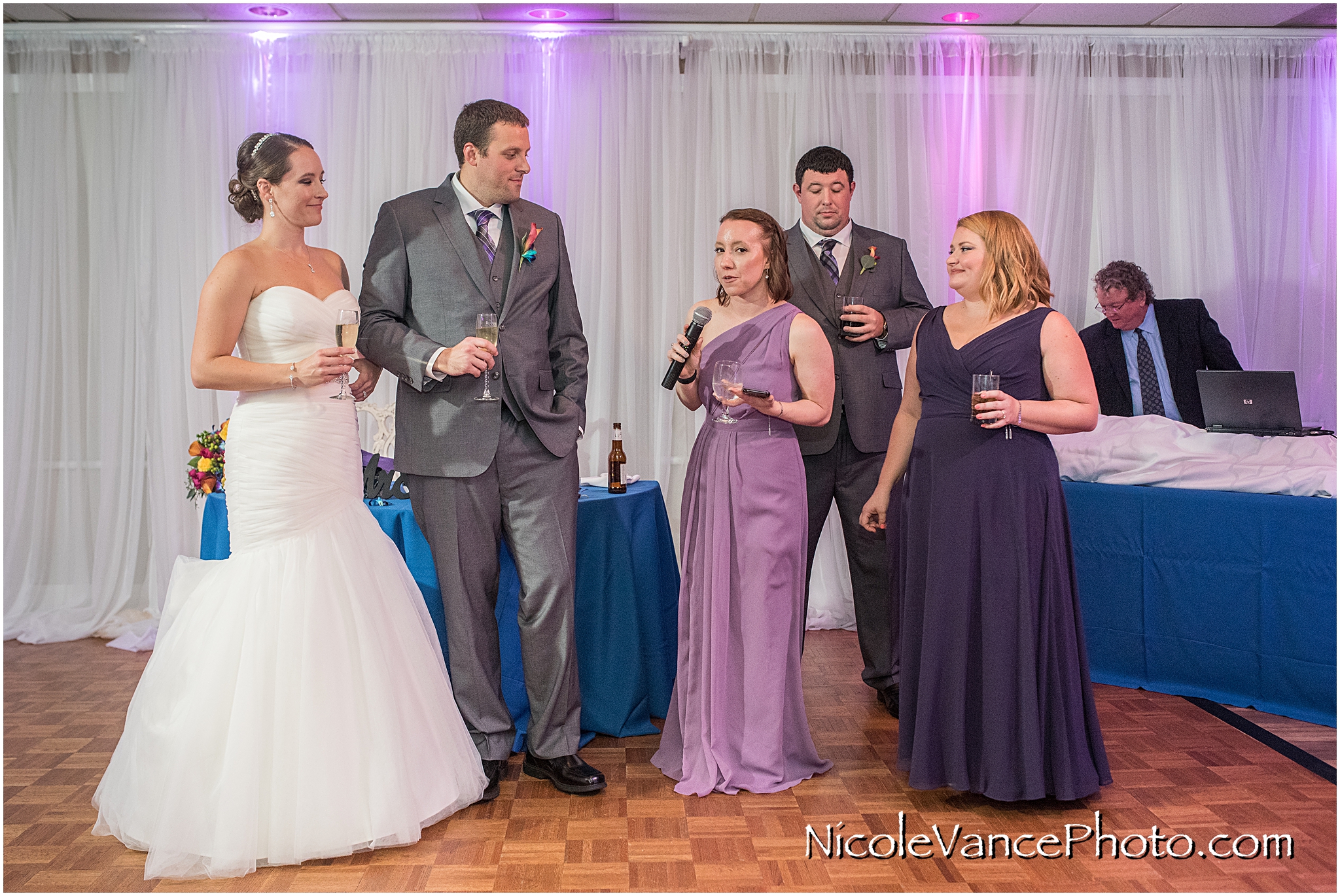 The maid of honor makes a toast to the bride and groom at The Brownstone in Richmond, VA.