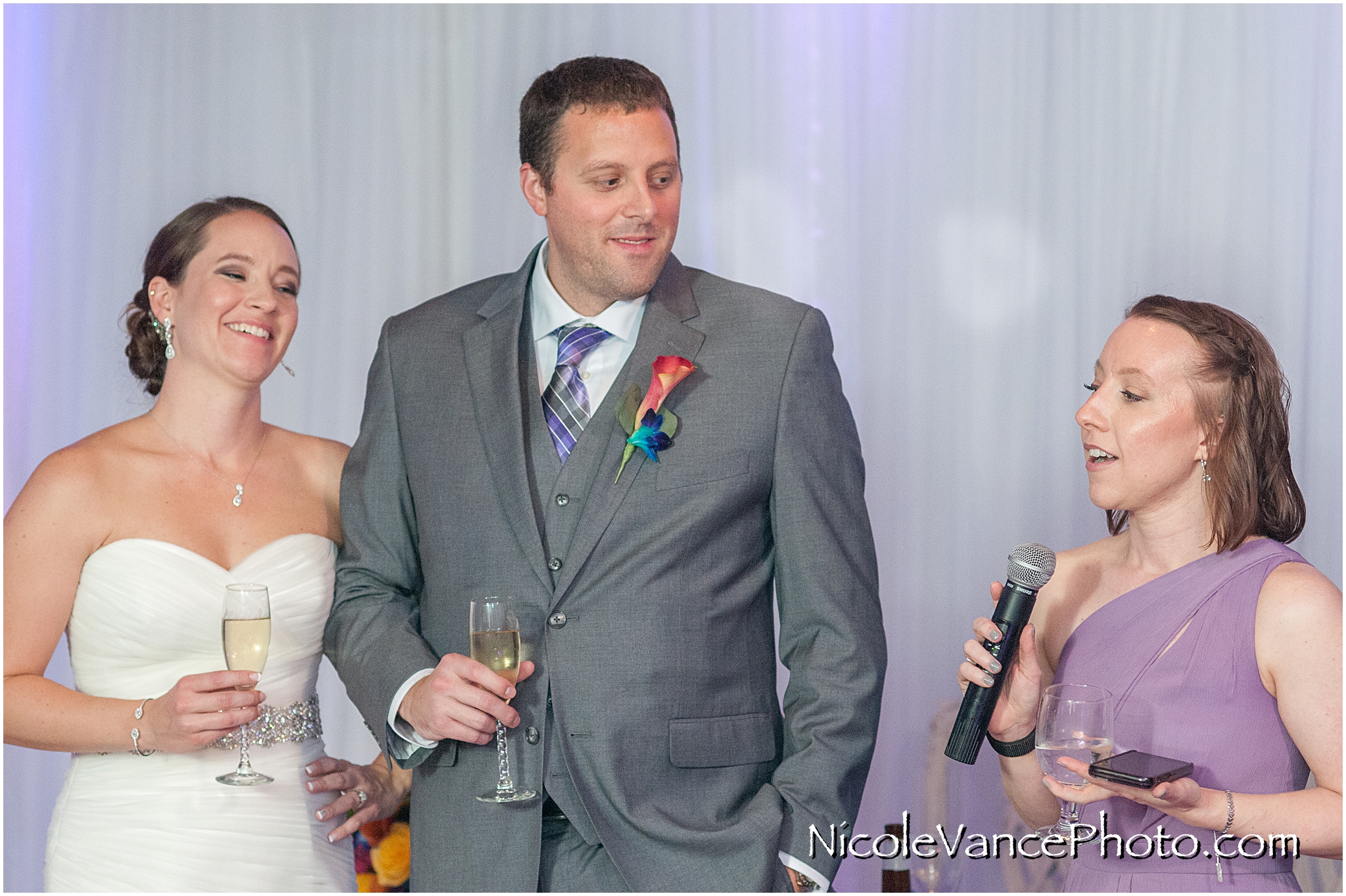 The maid of honor makes a toast to the bride and groom at The Brownstone in Richmond, VA.