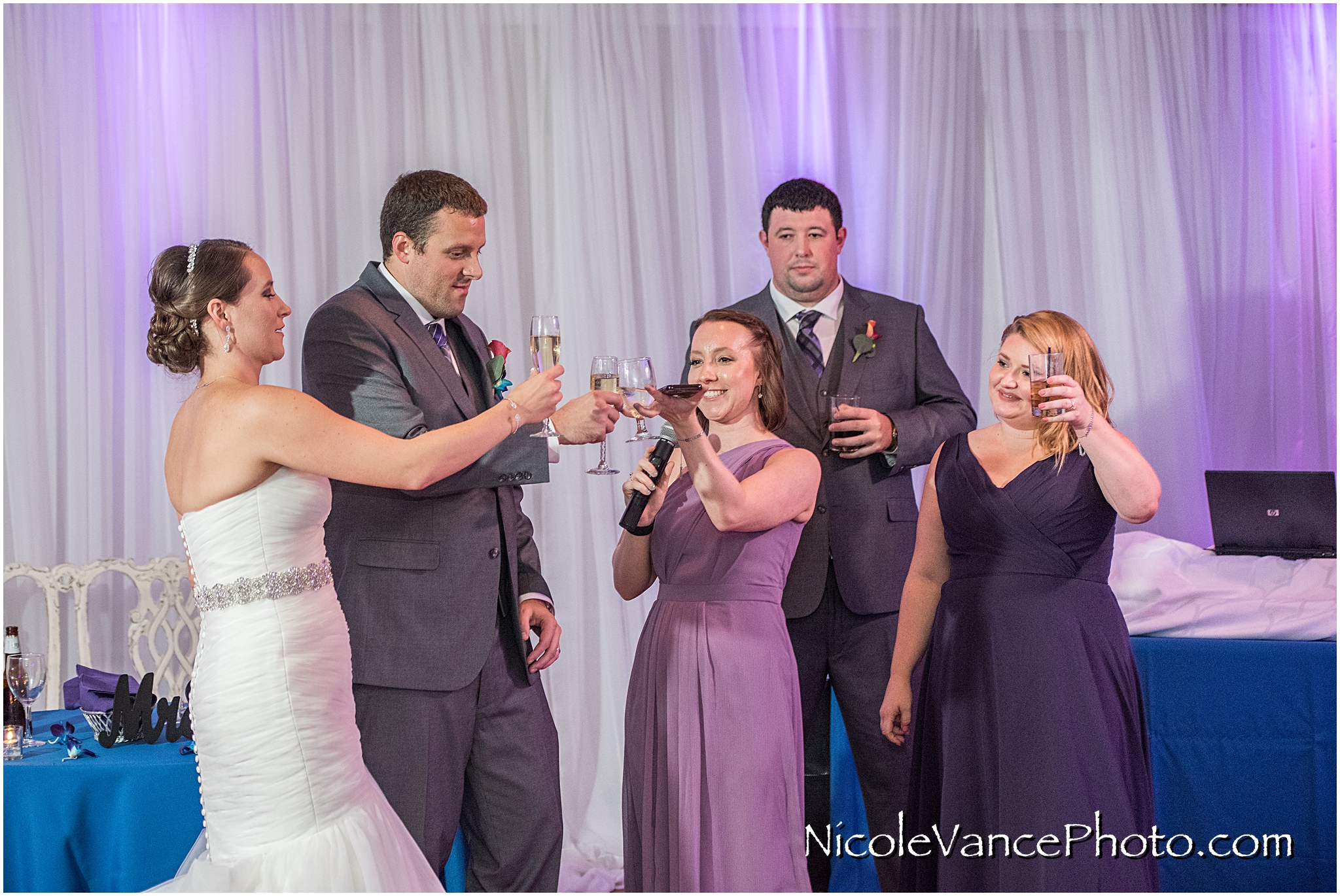 The maid of honor makes a toast to the bride and groom at The Brownstone in Richmond, VA.