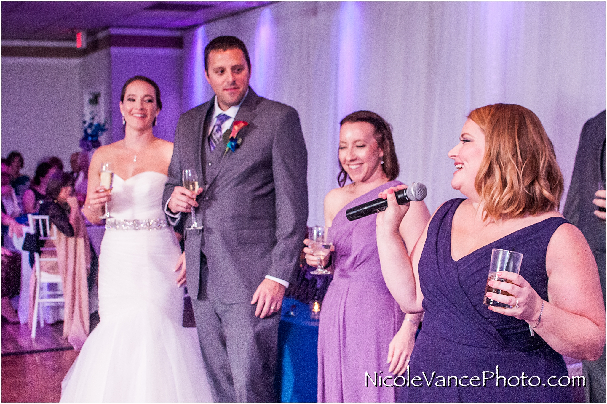 The maid of honor makes a toast to the bride and groom at The Brownstone in Richmond, VA.