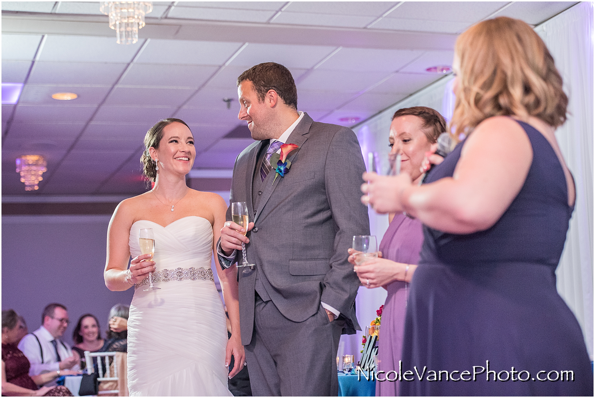 The maid of honor makes a toast to the bride and groom at The Brownstone in Richmond, VA.