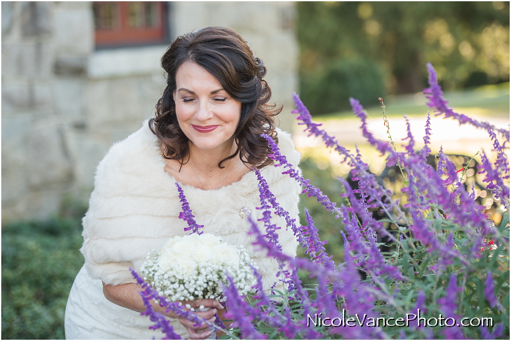 I love this candid photo of the bride smelling the flowers in the garden at Maymont Park in Richmond Virginia.