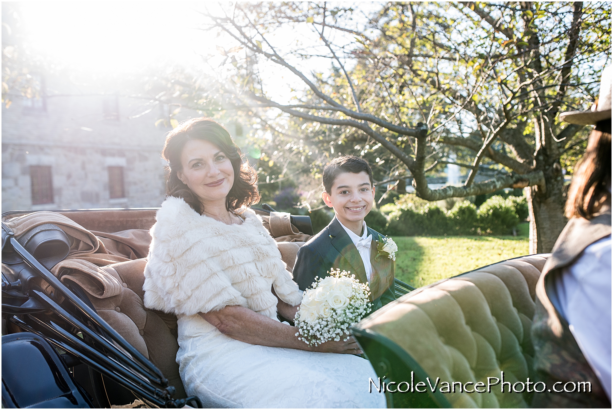 The bride and her son enjoy a horse drawn carriage ride to the wedding ceremony at Maymont Park in Richmond Virginia.