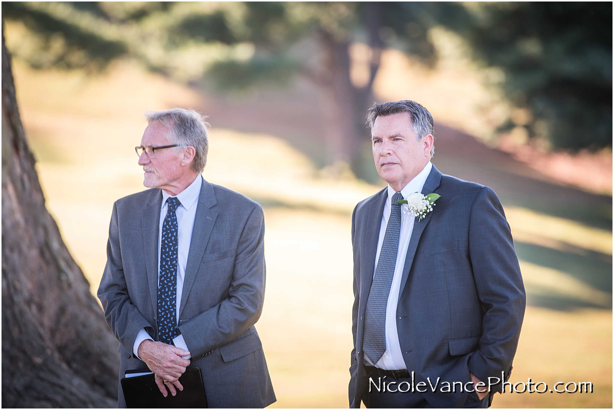 The groom watches as the horse drawn carriage arrives at their Maymont Park wedding ceremony.