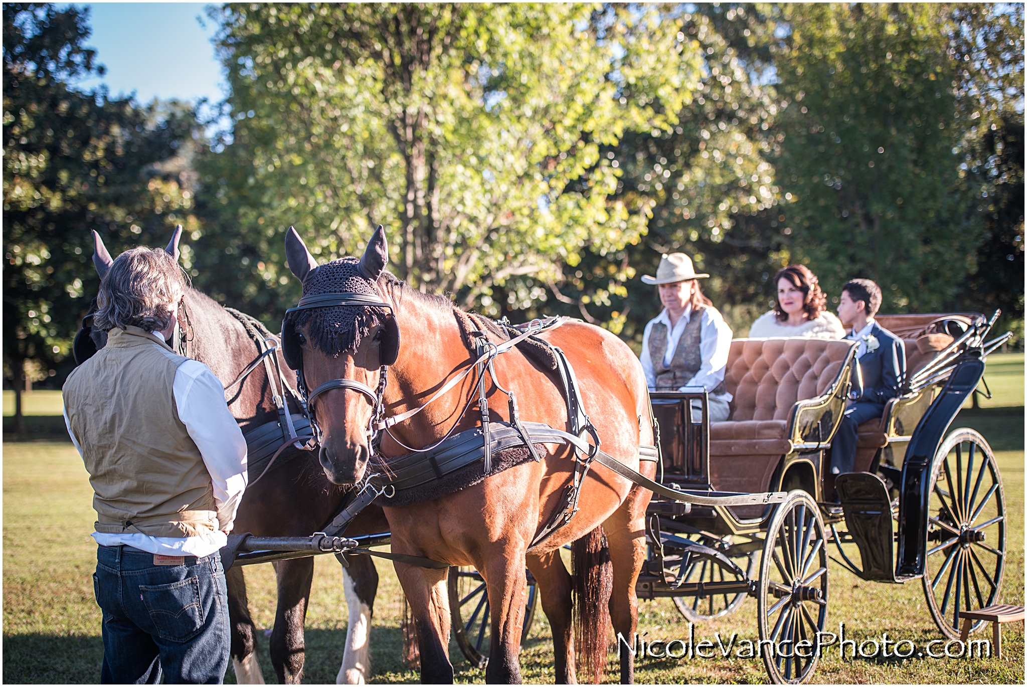 The bride and her son enjoy a horse drawn carriage ride to the wedding ceremony at Maymont Park in Richmond Virginia.