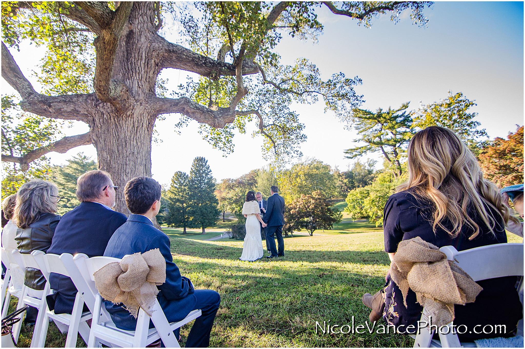 Guests enjoy the wedding ceremony at Maymont Park in Richmond, Virginia.