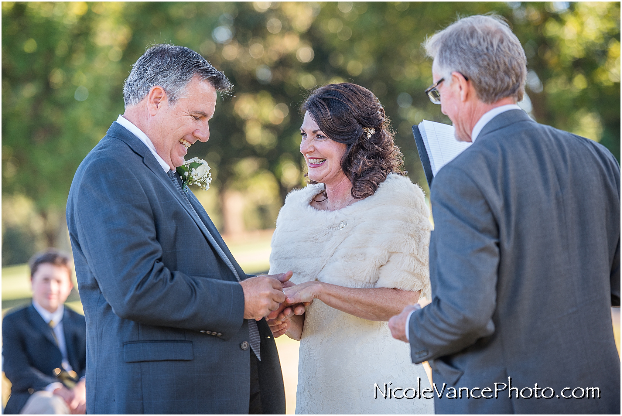 The couple exchange rings during their ceremony at Maymont Park.