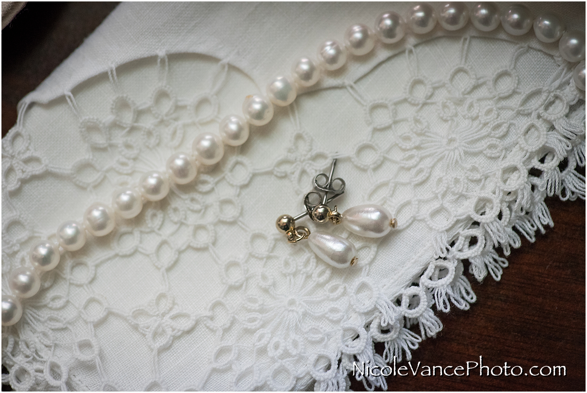The wedding jewelry consisted of pearls and a beautiful handkerchief.