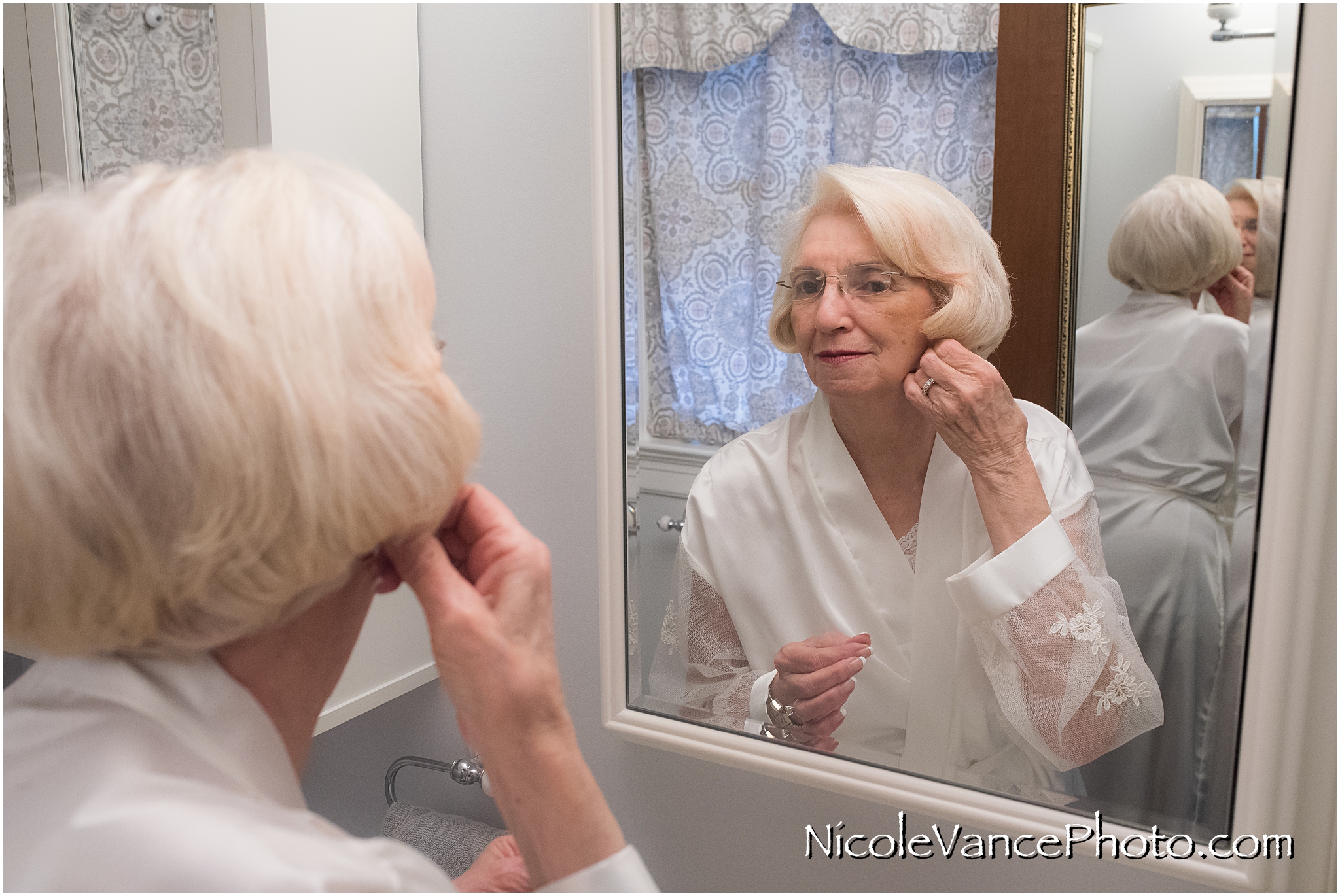 The bride gets ready at her home.