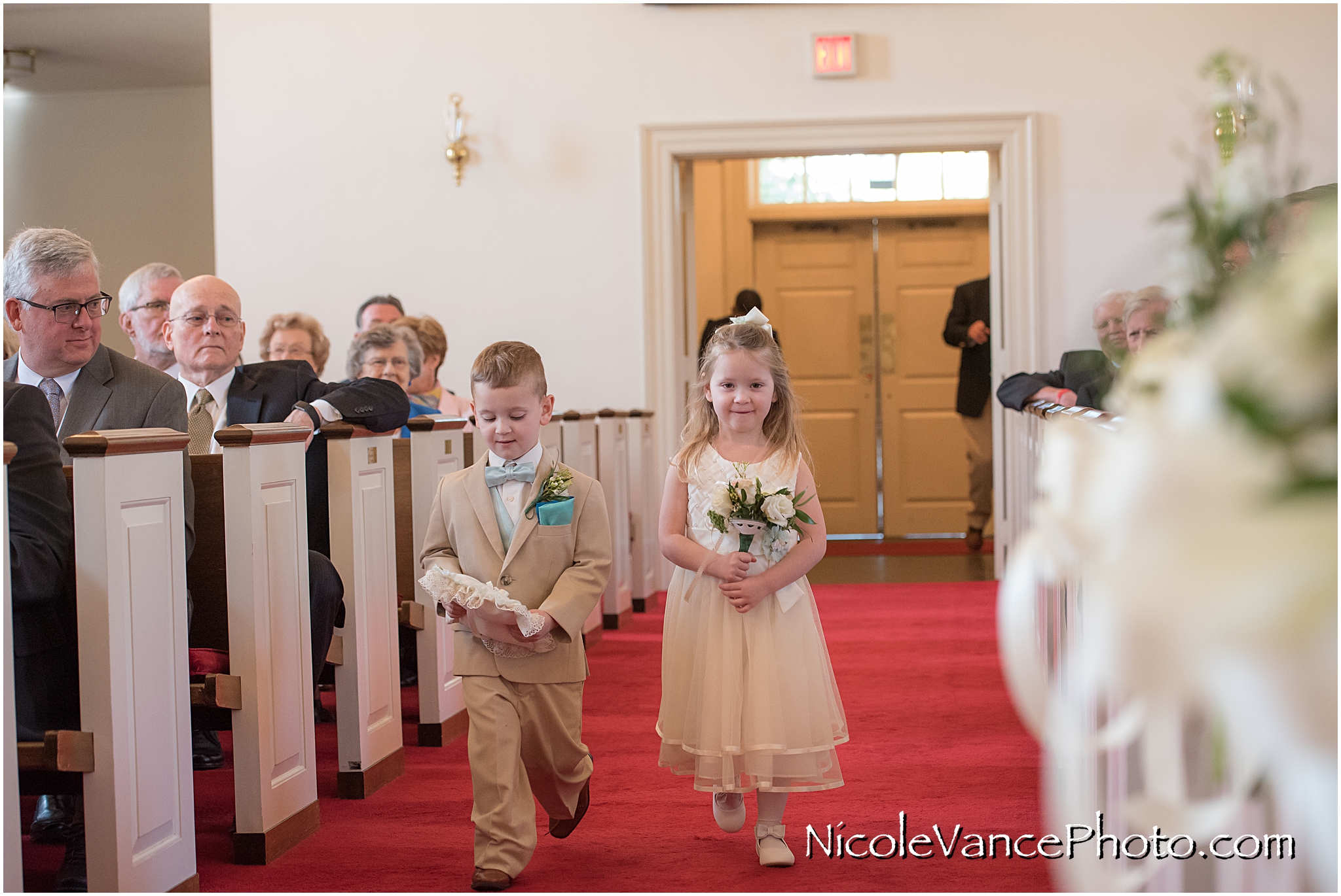 The flower girl and ring bearer process at Crestwood Presbyterian Church in Chesterfield VA.