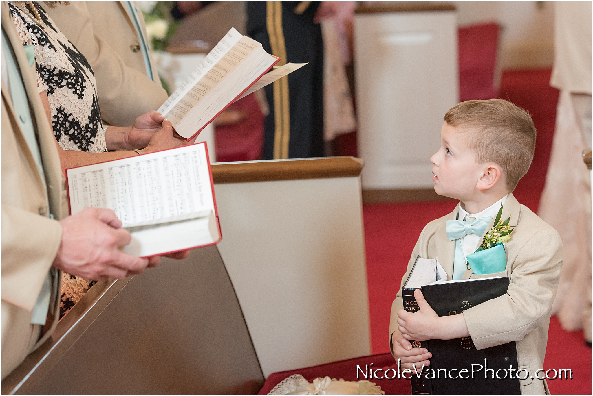 The ring bearer at the wedding ceremony at Crestwood Presbyterian Church in Richmond VA
