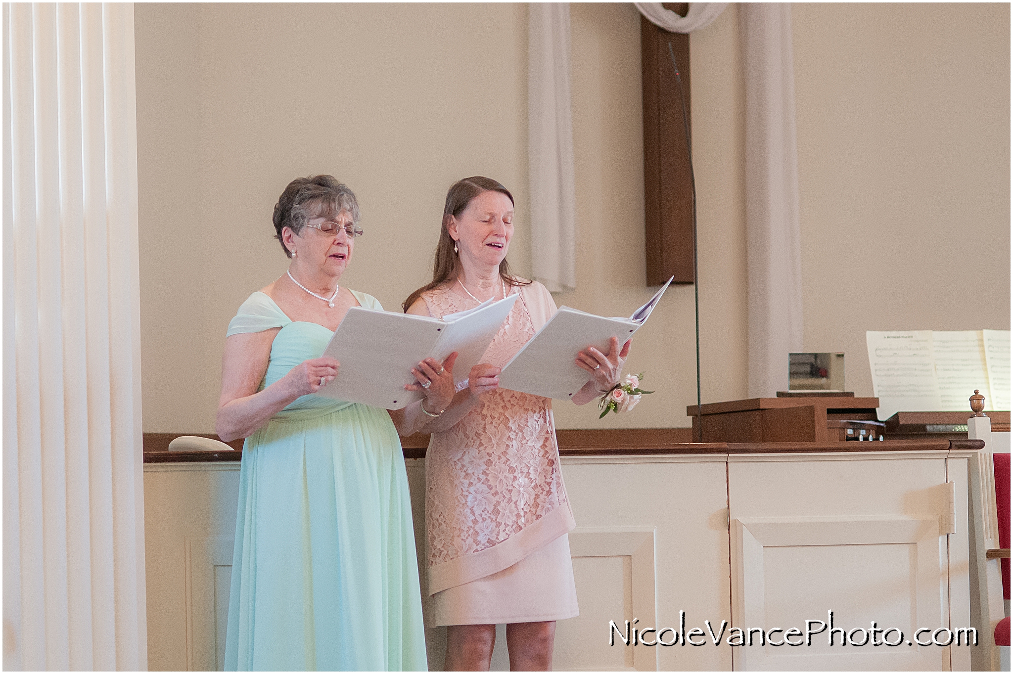 Family members perform a hymn at the wedding ceremony at Crestwood Presbyterian Church in Richmond VA