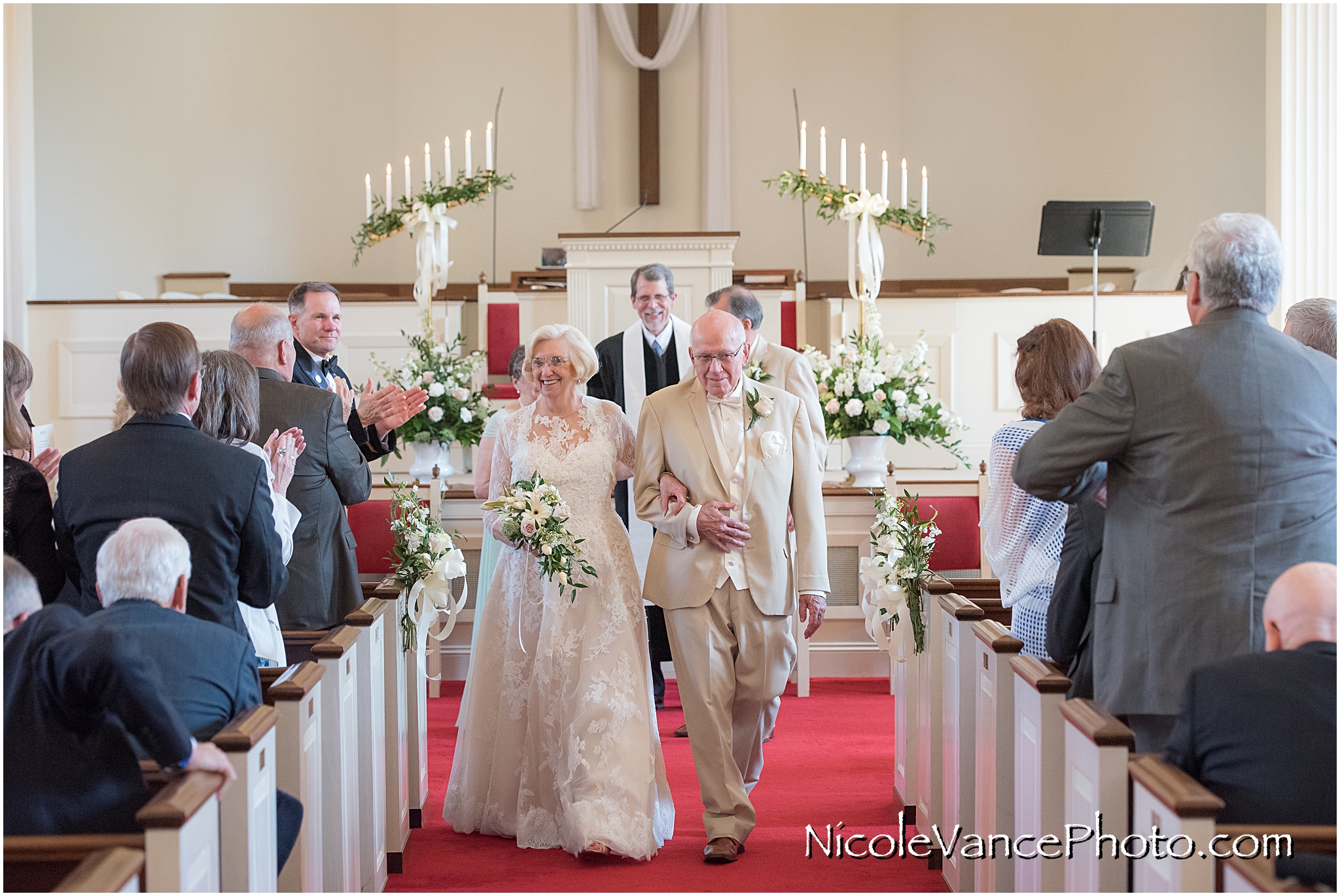 The newlyweds walk down the aisle at Crestwood Presbyterian Church in Richmond VA