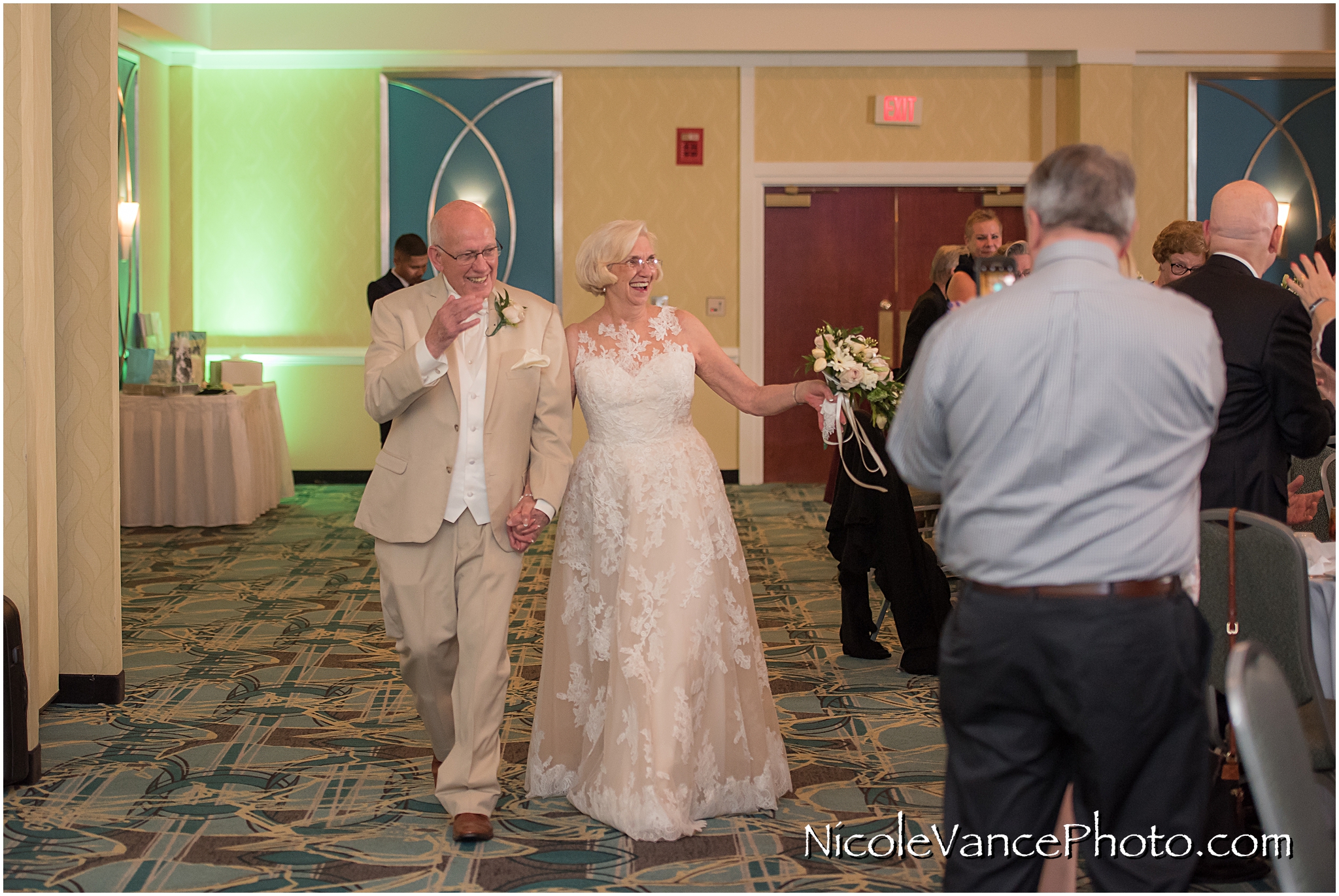 The bride and groom are announced into the ballroom at the Doubletree by Hilton Richmond-Midlothian.