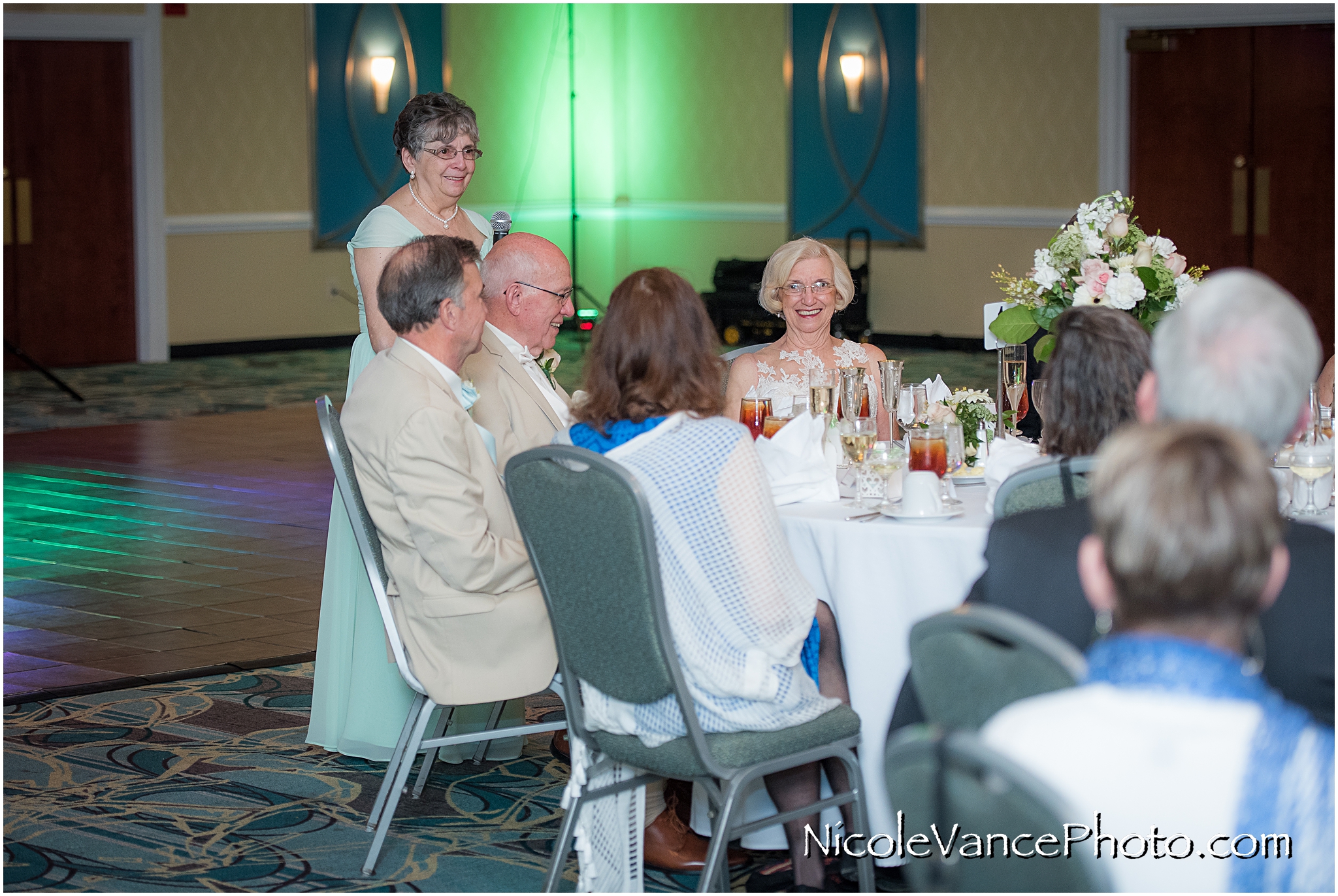 The matron of honor proposes a toast to the bride and groom are announced into the ballroom at the Doubletree by Hilton Richmond-Midlothian.