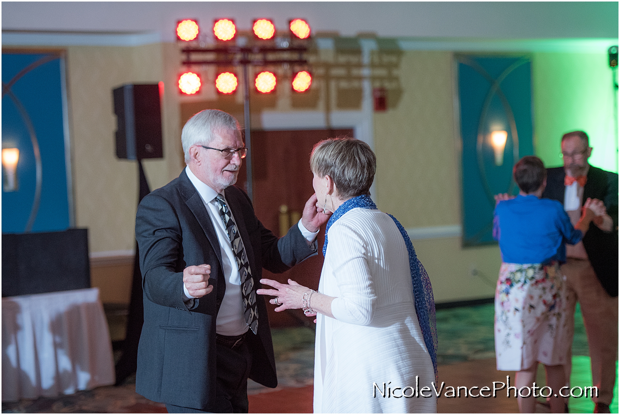 Wedding guests enjoy the reception at the ballroom at the Doubletree by Hilton Richmond-Midlothian.