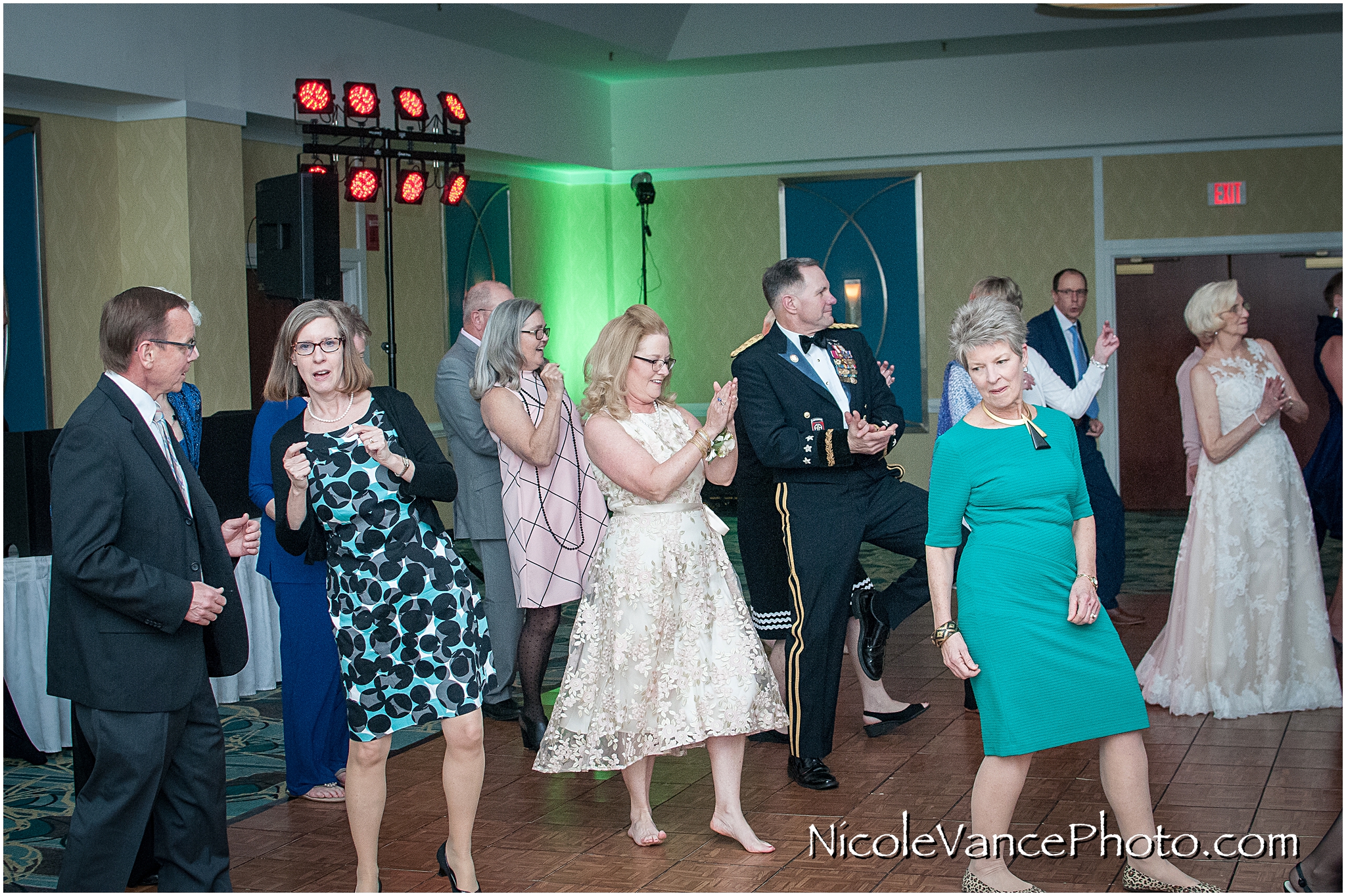 Wedding guests enjoy the reception at the ballroom at the Doubletree by Hilton Richmond-Midlothian.