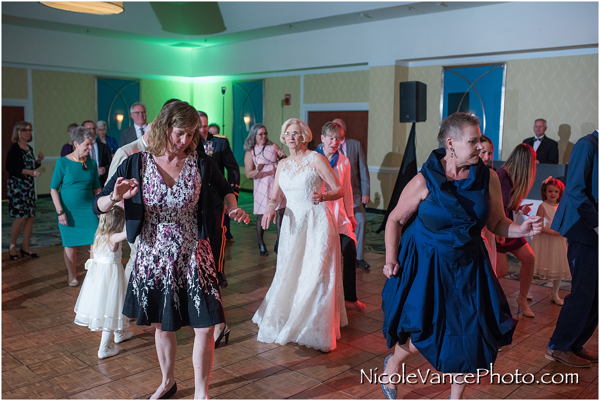 Wedding guests enjoy the reception at the ballroom at the Doubletree by Hilton Richmond-Midlothian.