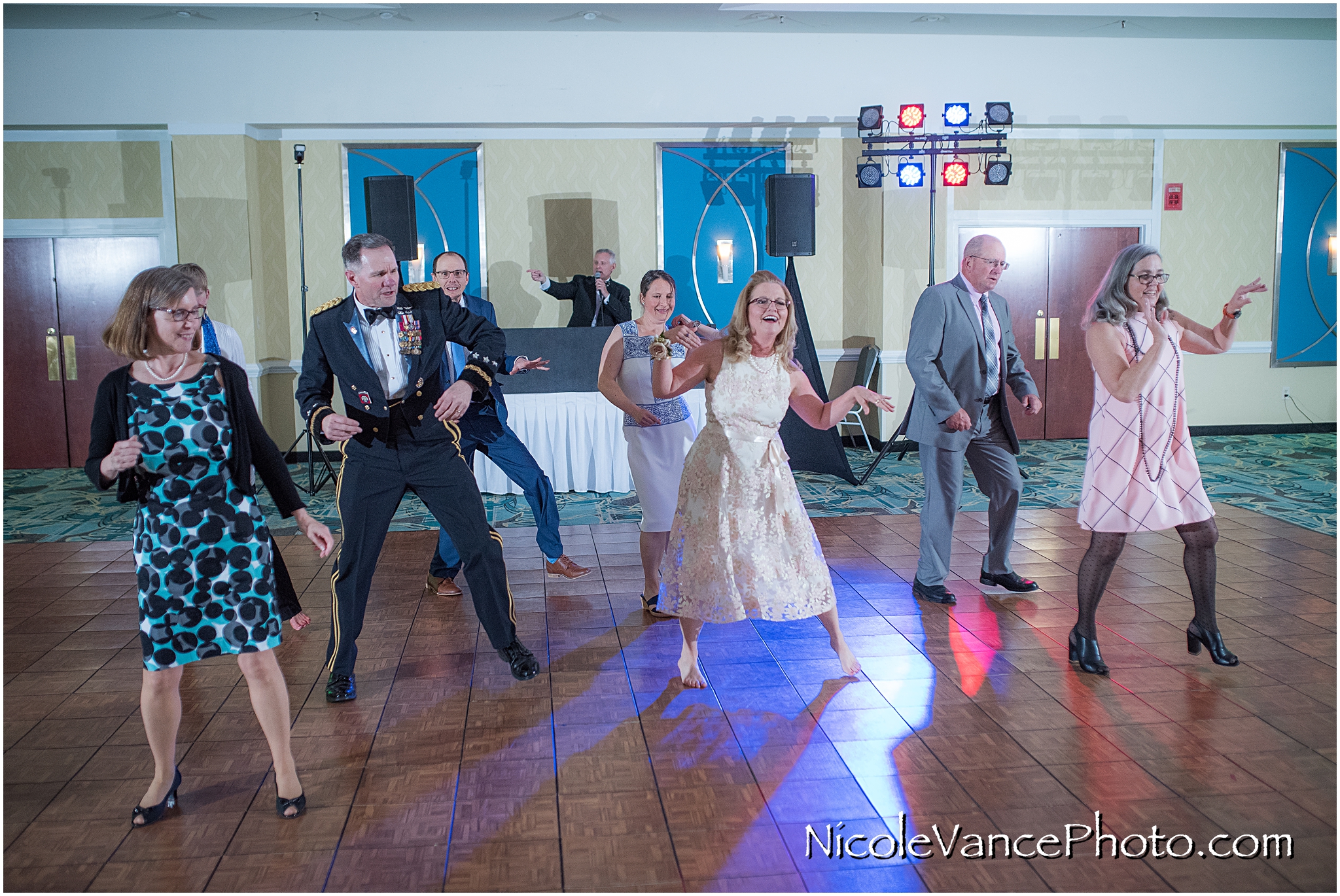 Wedding guests enjoy the reception at the ballroom at the Doubletree by Hilton Richmond-Midlothian.