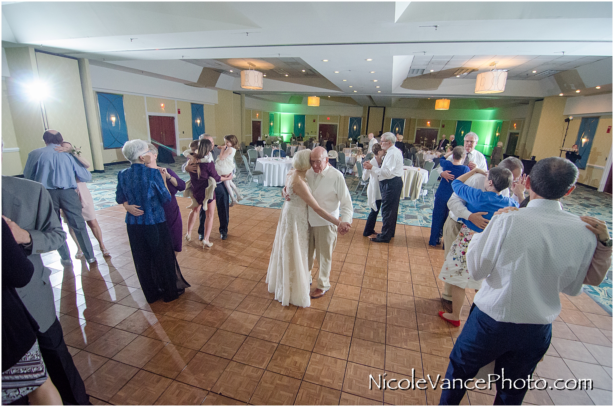 Wedding guests enjoy the reception at the ballroom at the Doubletree by Hilton Richmond-Midlothian.