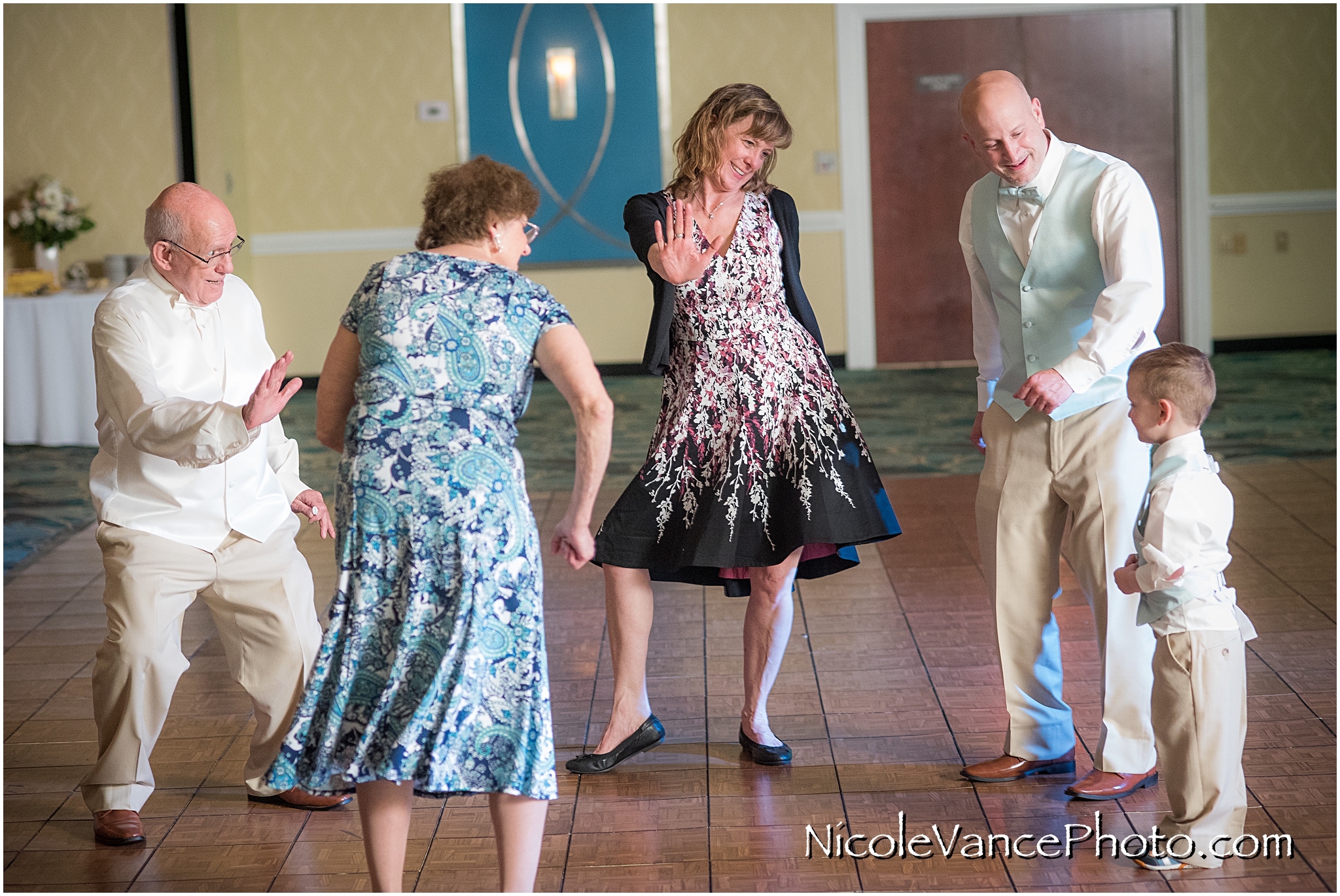 Wedding guests enjoy the reception at the ballroom at the Doubletree by Hilton Richmond-Midlothian.